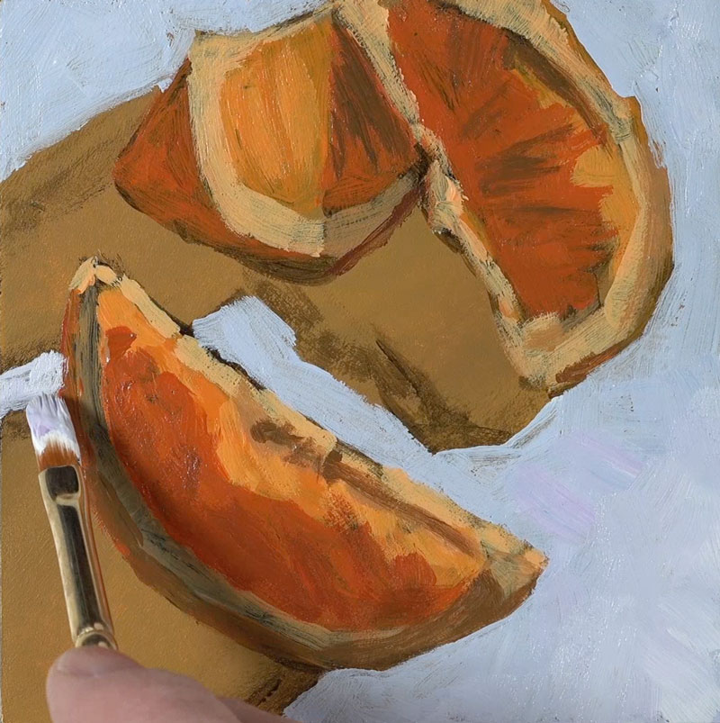 阻塞在桔子背后的背景颜色与丙烯酸涂料