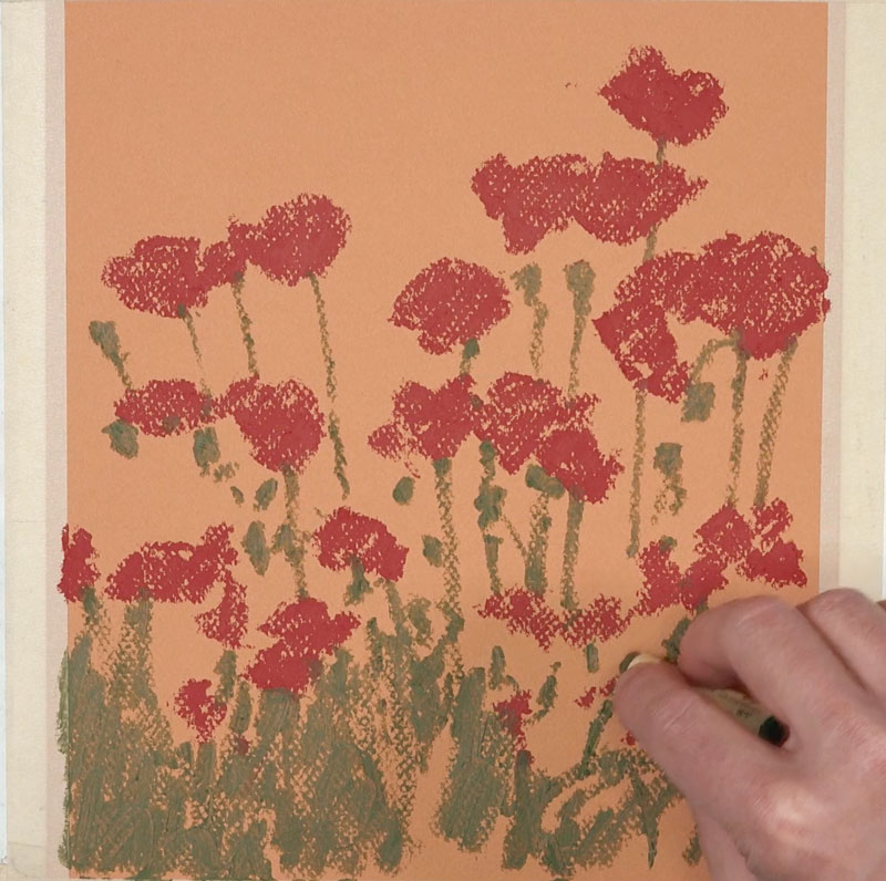 Painting shapes of flowers with oil pastels